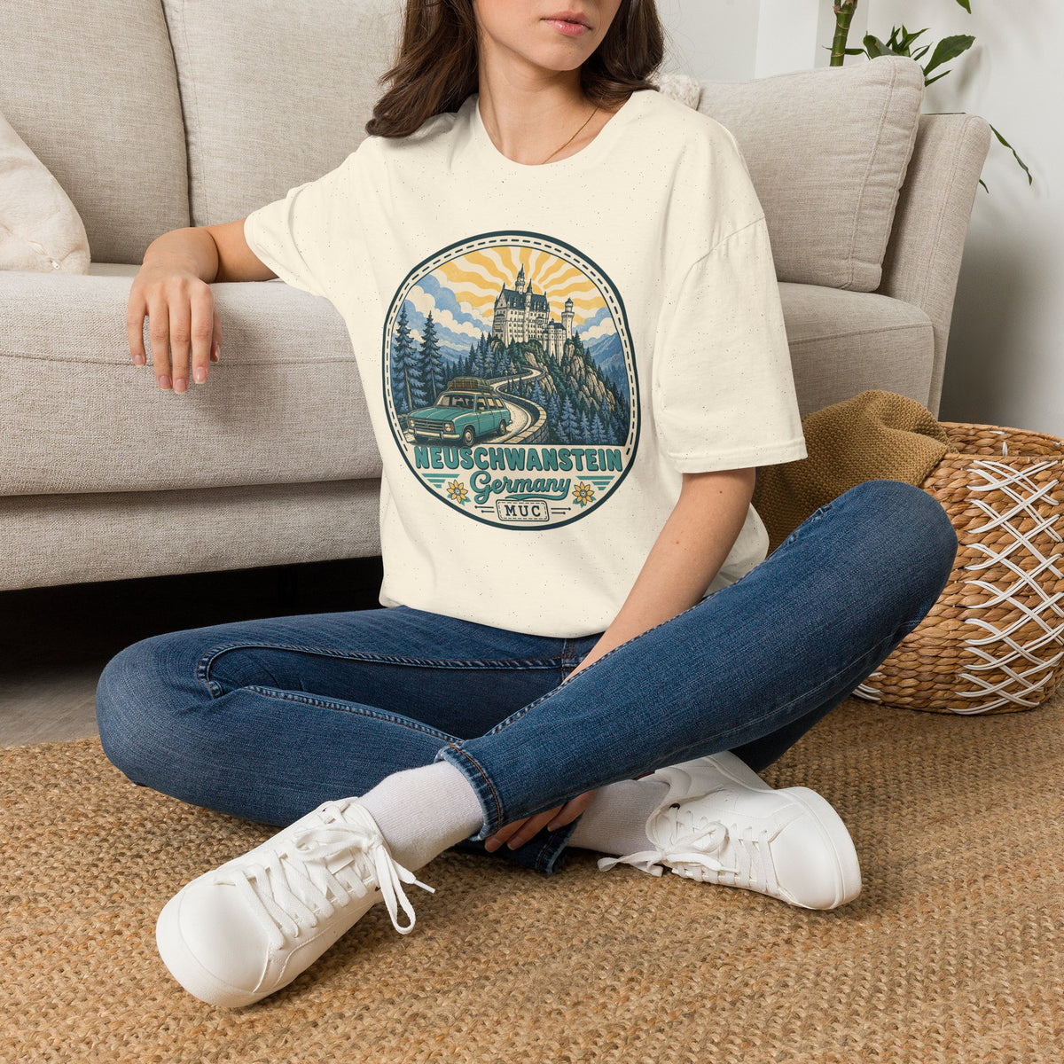 Light cream graphic T-shirt with circular Neuschwanstein castle illustration on chest