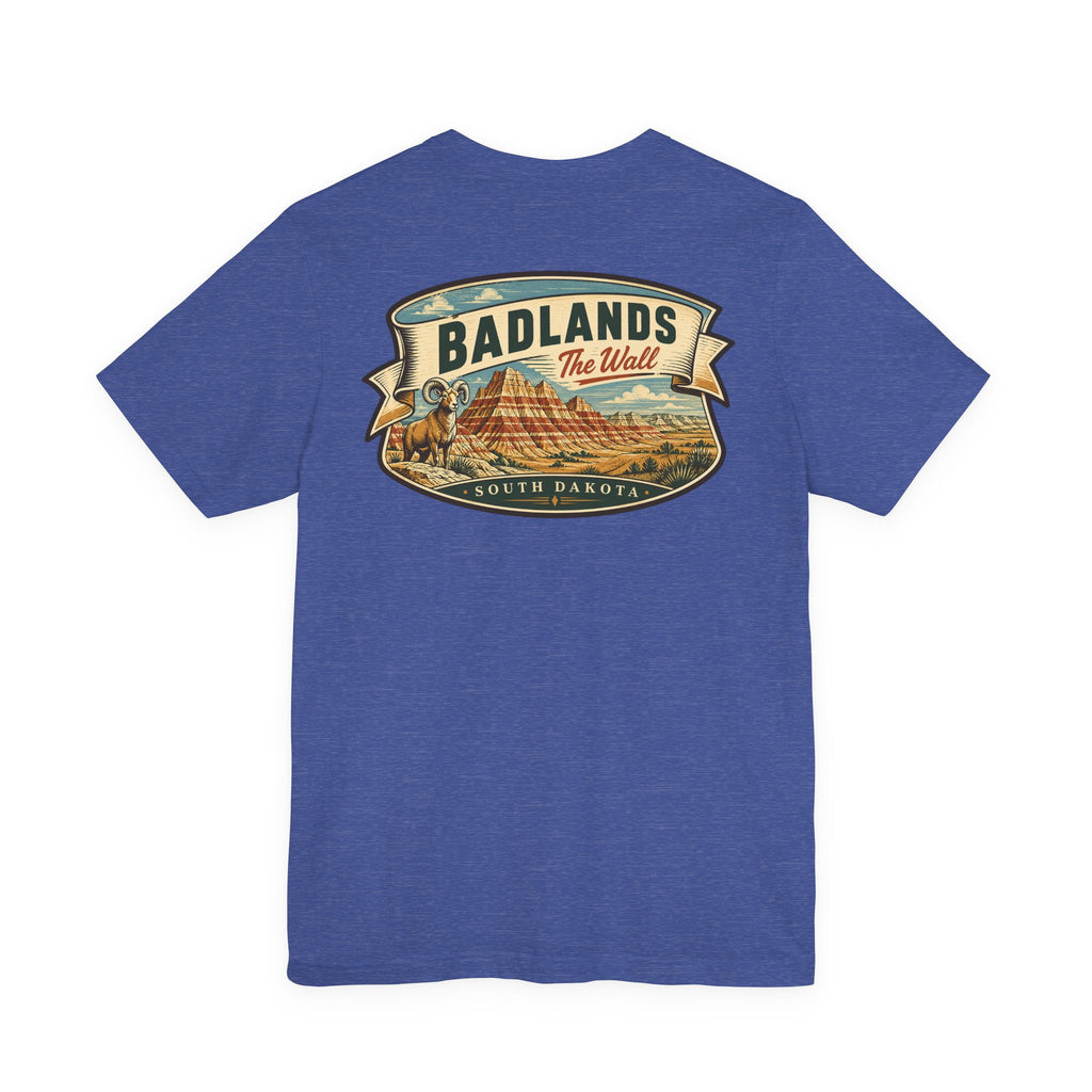 Blue T-shirt with “BADLANDS” landscape graphic and badge-style emblem across the chest