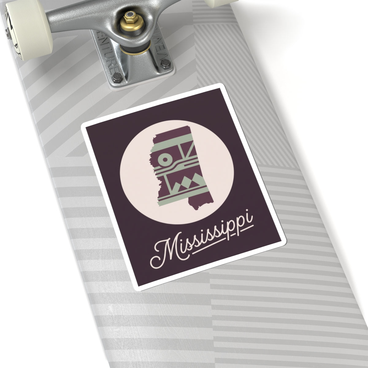 Mississippi sticker decal on grey-striped surface; purple square border with circular emblem