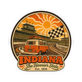 Circular decal featuring orange racing van, track curves, checkered flag, and Hoosier State