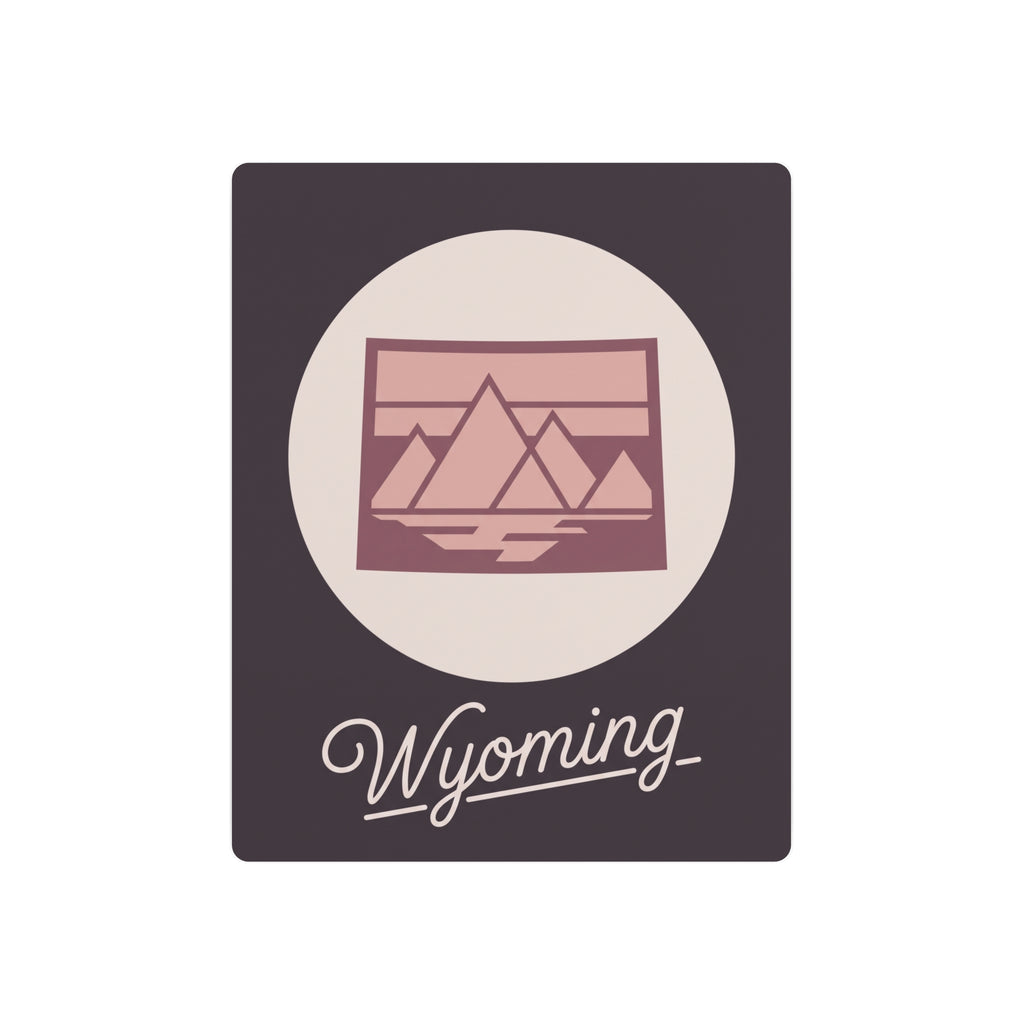 Square mauve metal wall art with oval landscape emblem and script “Wyoming”