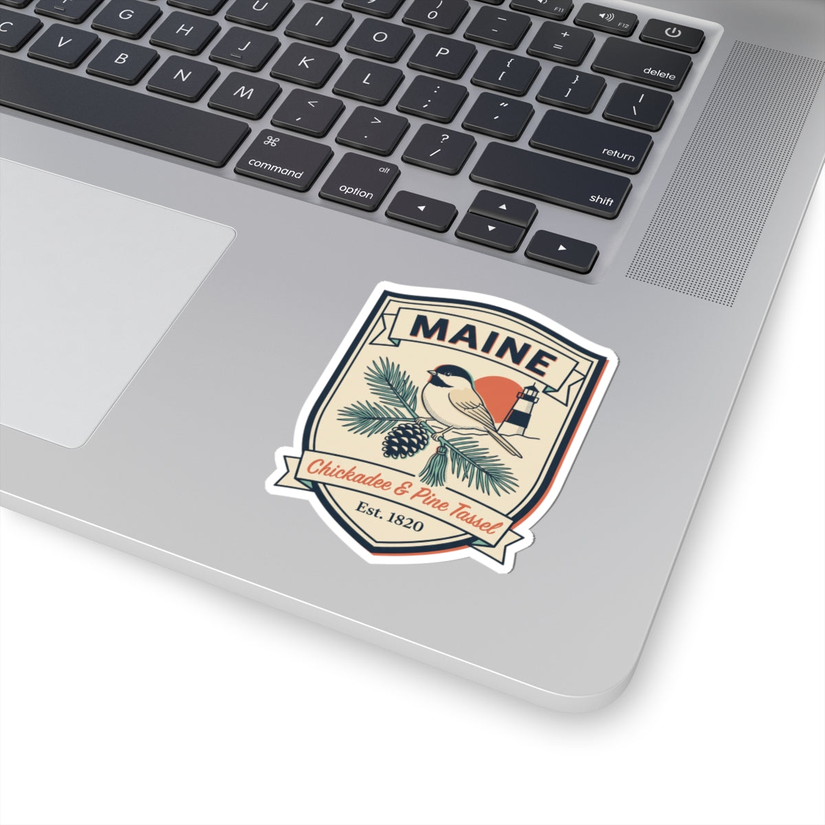 Maine vintage badge decal sticker with bird, lighthouse, and pine greenery