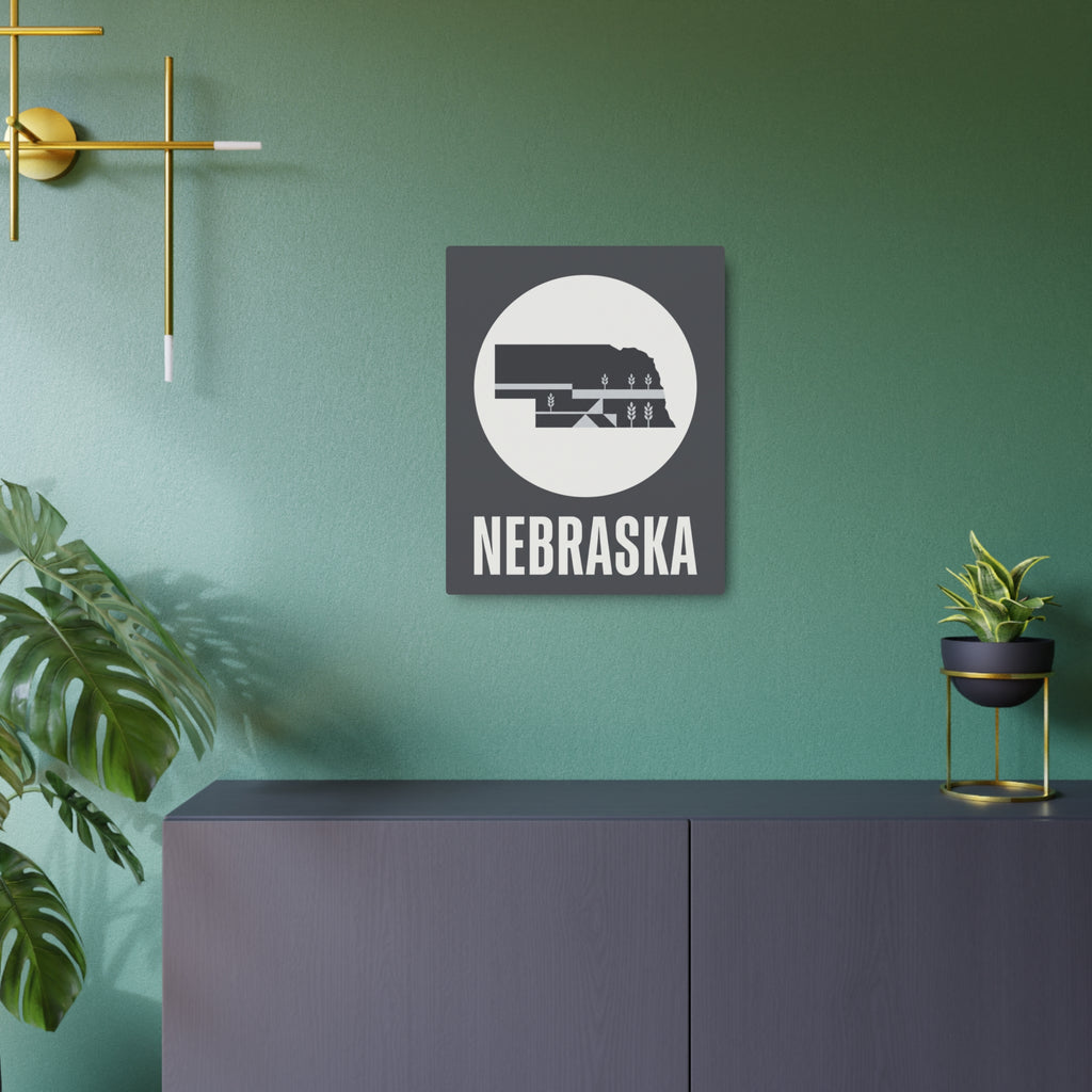 Square steel Nebraska wall art sign with wheat motif and raised outline, dark gray.