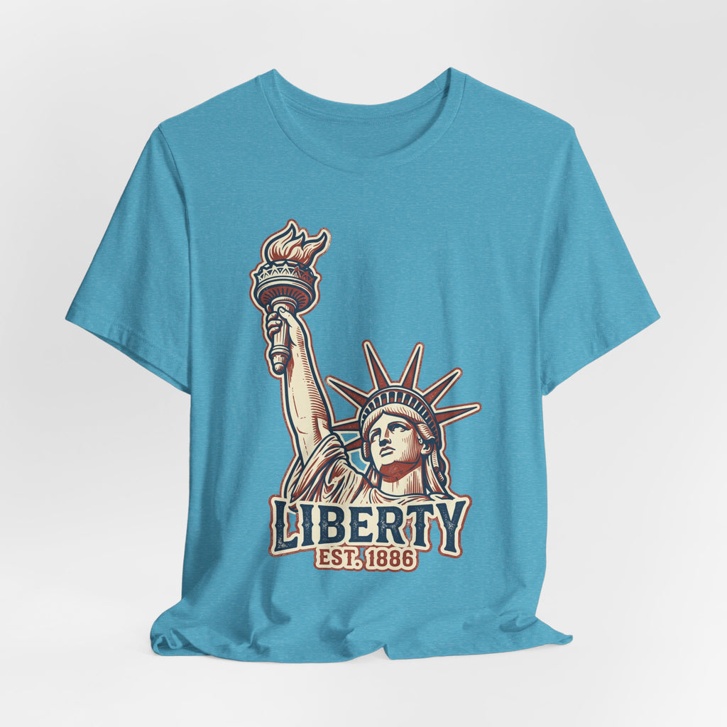 Light blue crewneck tee with Liberty graphic print and EST. 1886 text centered.