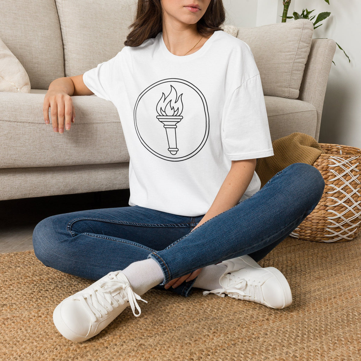 White t-shirt with minimalist flame torch circle graphic on the chest