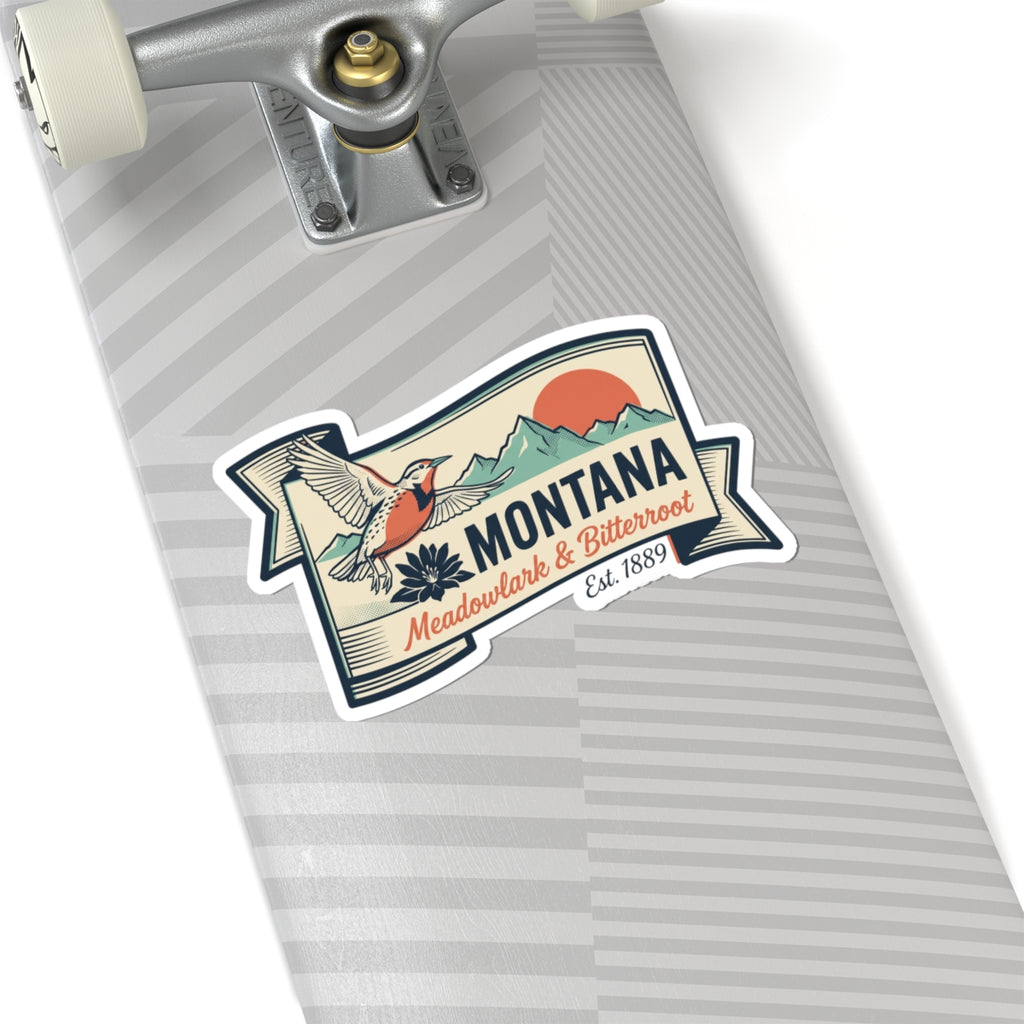 Montana state badge vinyl sticker on gray striped surface with bird and Montana text