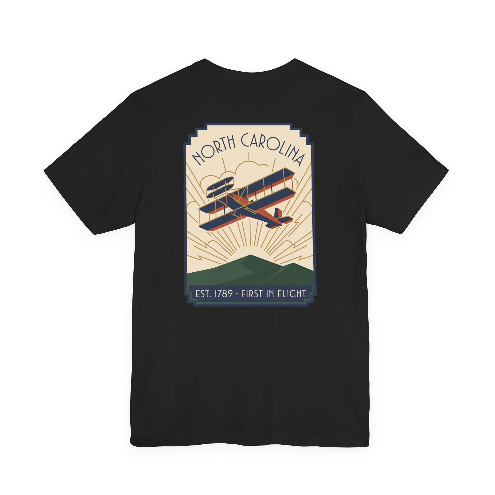 Black t-shirt with North Carolina biplane graphic and 'Est. 1789 - First in Flight' text