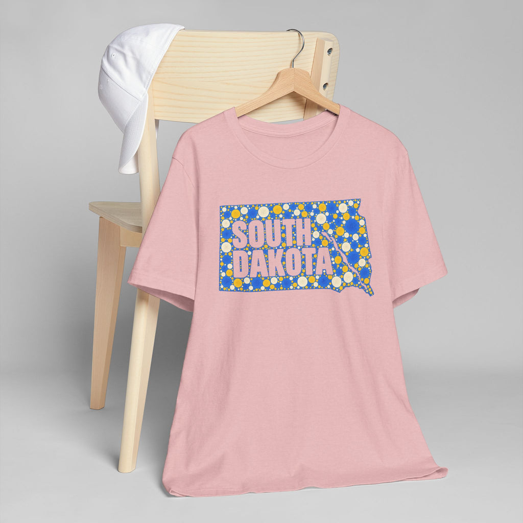 Dusty pink crew-neck t-shirt with colorful South Dakota map graphic on front.