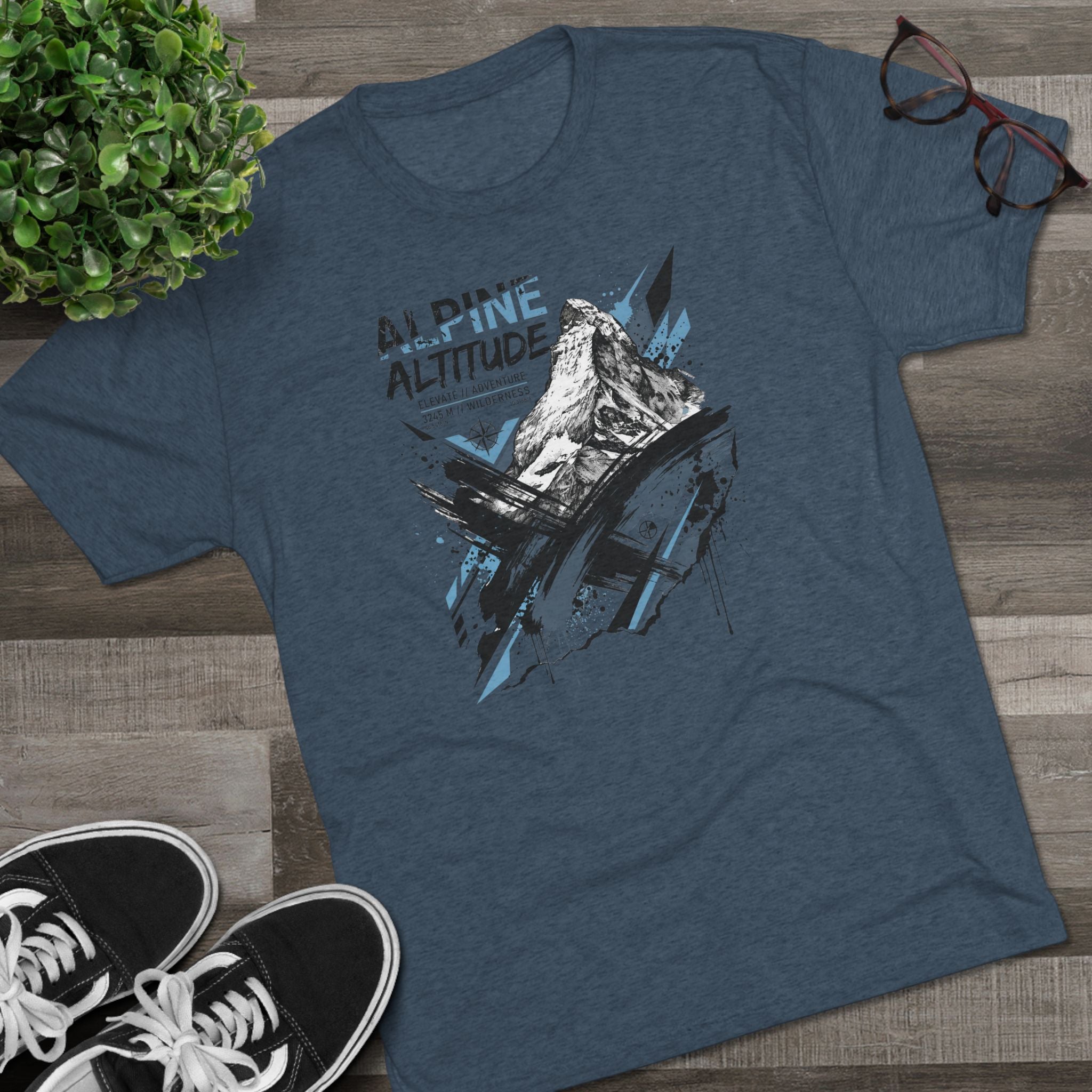 Unisex dark slate blue T-shirt with mountain peak graphic in blue and white