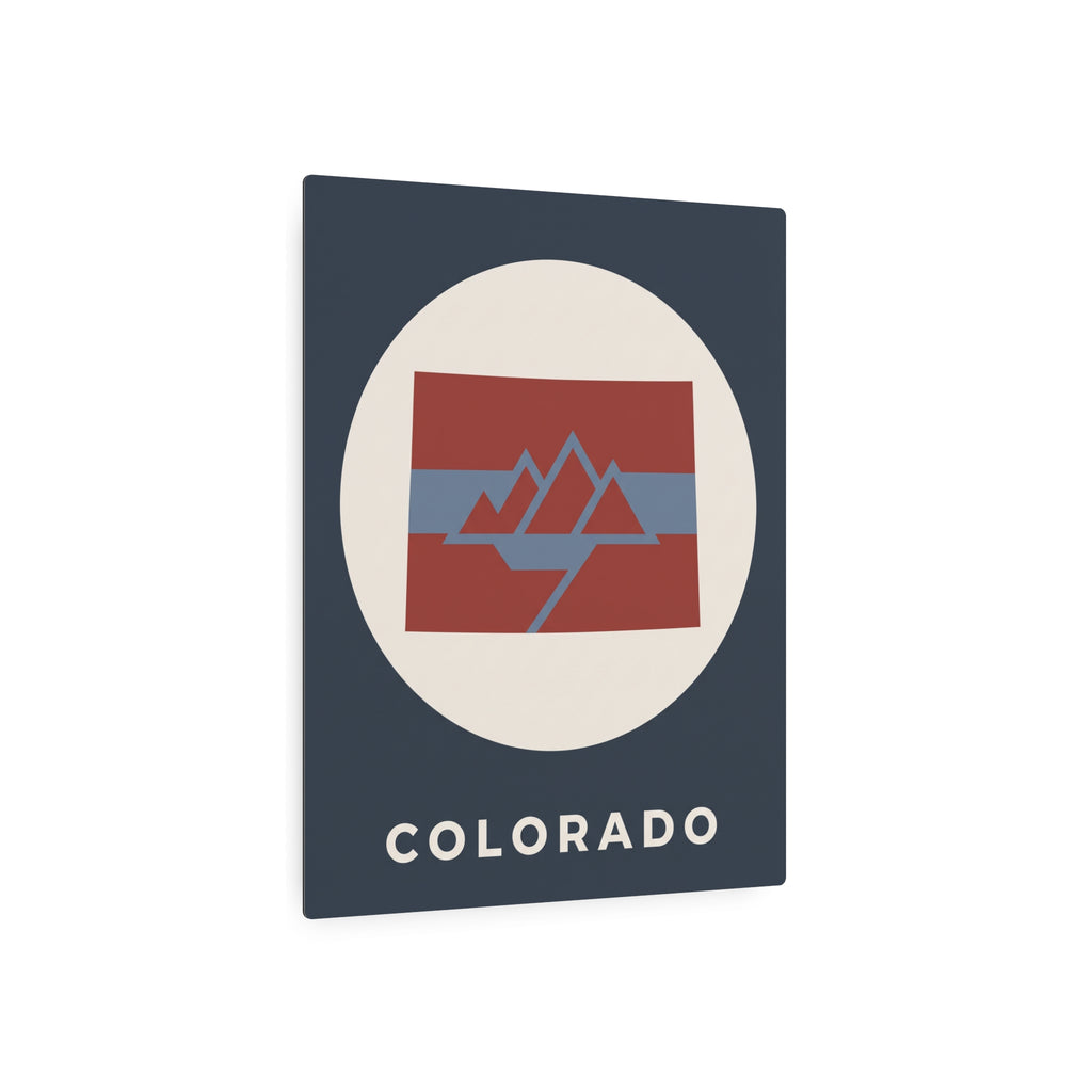 Colorado metal art sign with cream circle, red-blue mountain flag graphic and “COLORADO”