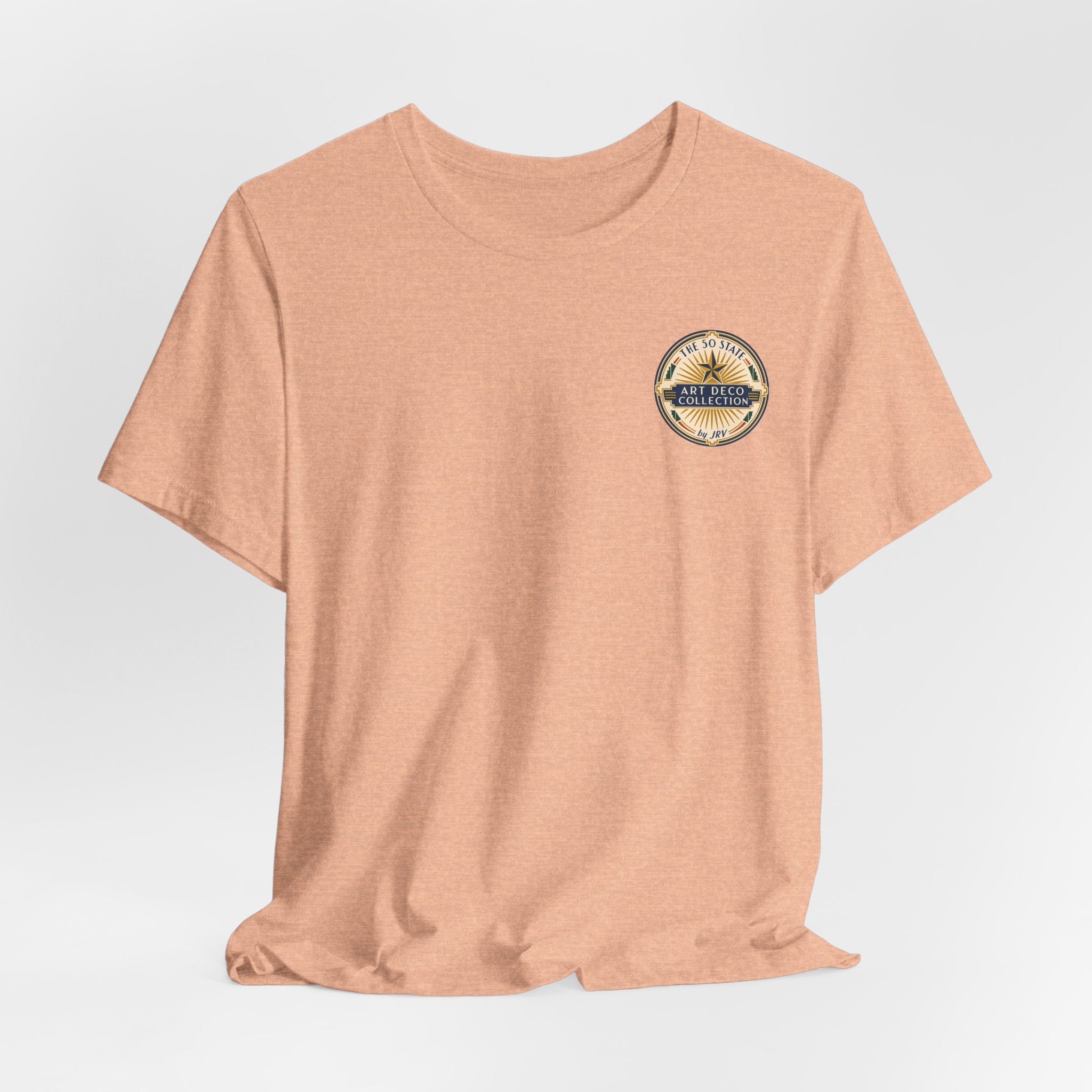 Peach T-shirt with small round Art Deco logo patch at upper chest