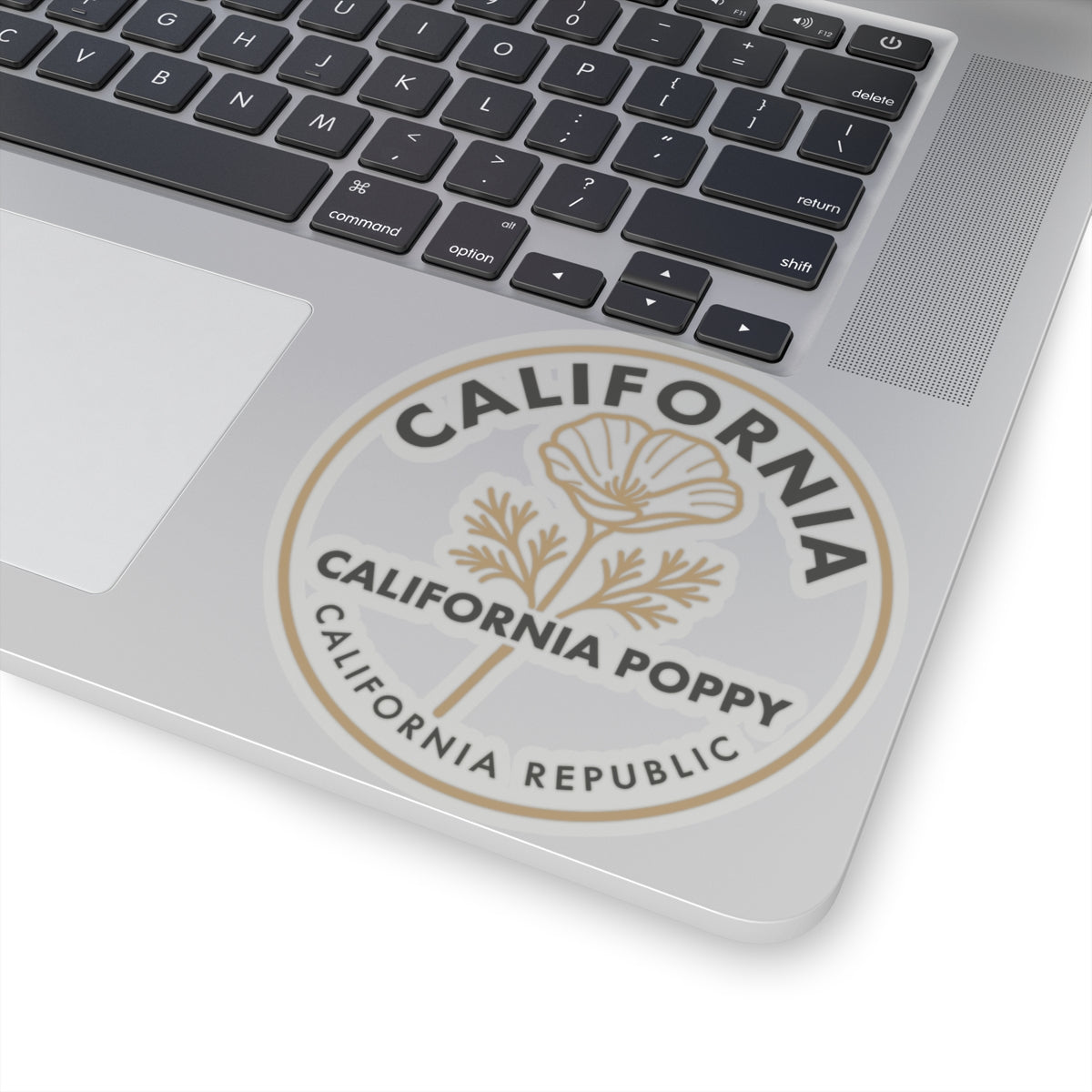 California poppy round sticker on laptop lid, beige flower and California Republic wording