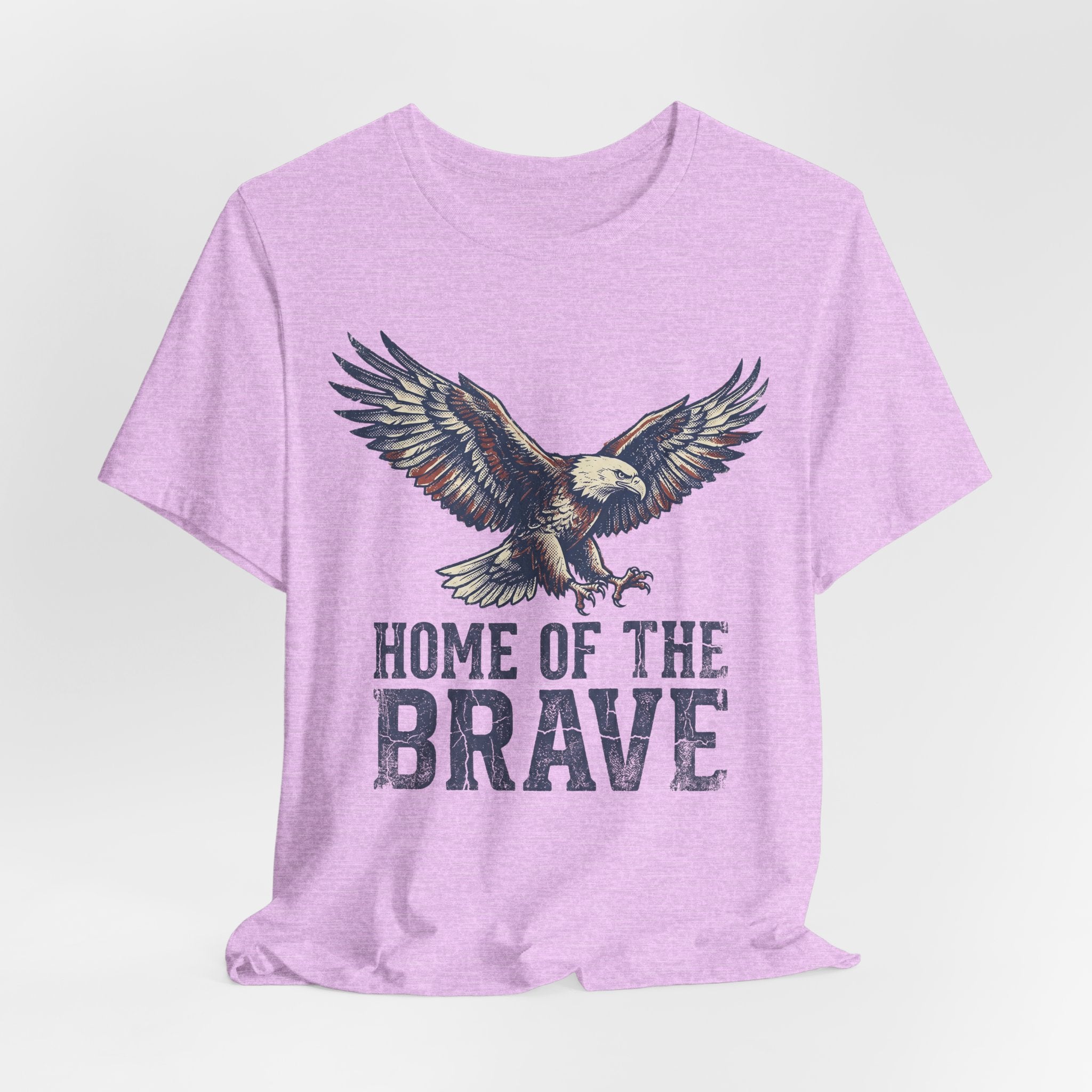 Heathered lilac crew-neck T-shirt with eagle and 'HOME OF THE BRAVE' text.