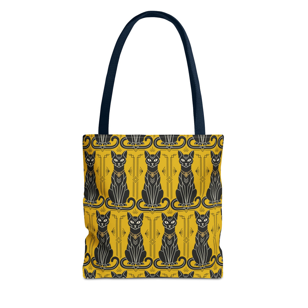 Yellow tote bag with repeating black cat faces and ornate border; navy shoulder straps