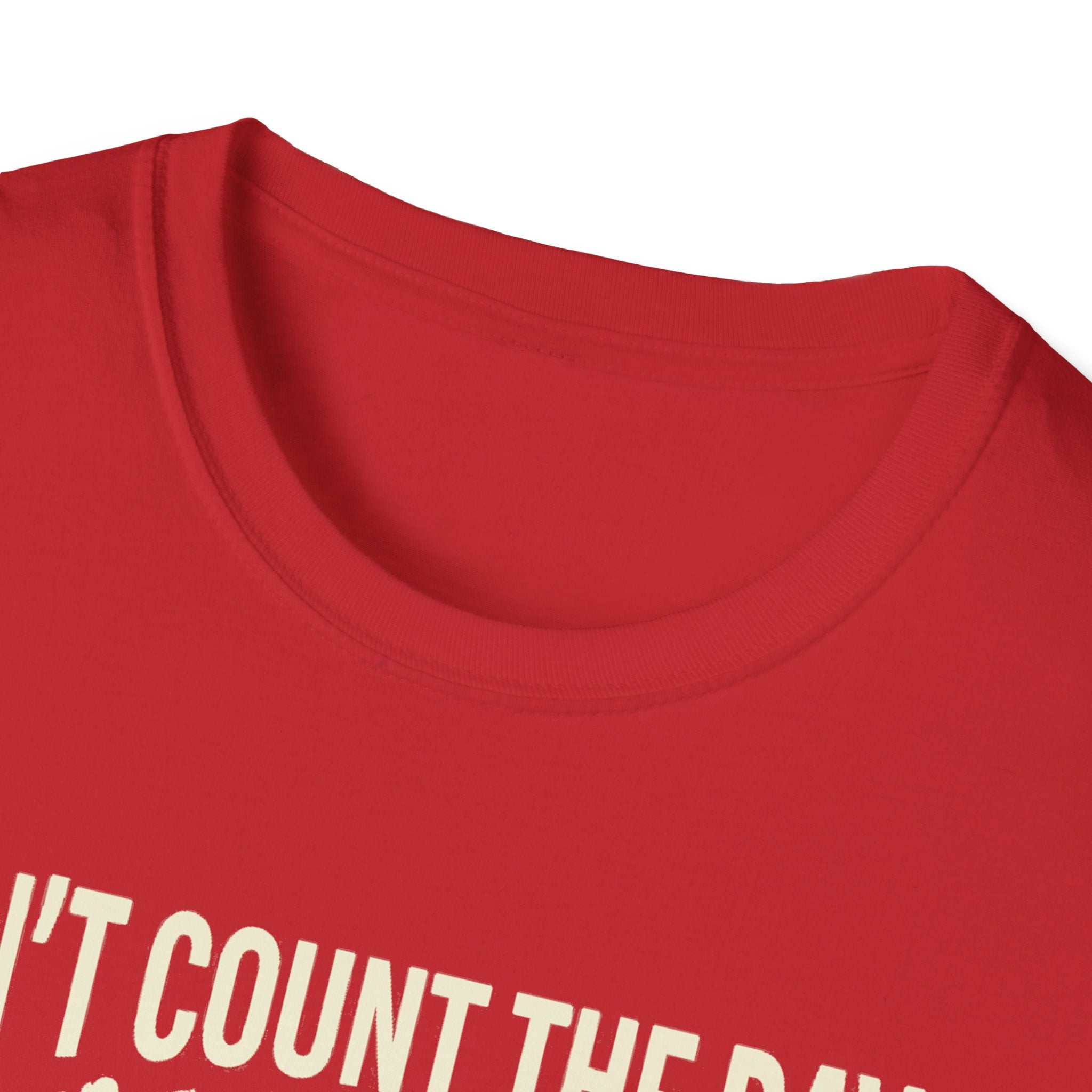 Red T-shirt neckline with partial “COUNT THE DAYS” quote text