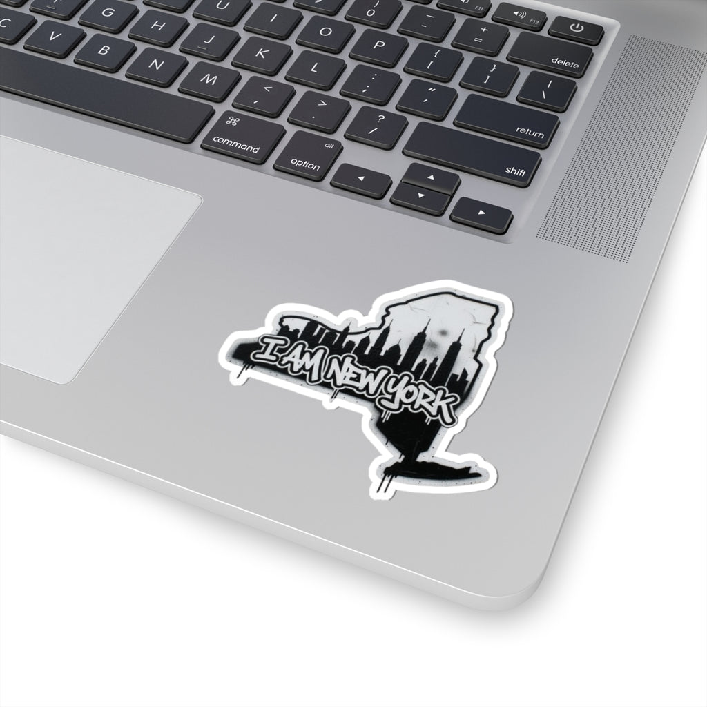 I AM NEW YORK sticker on laptop, white border, black buildings and text