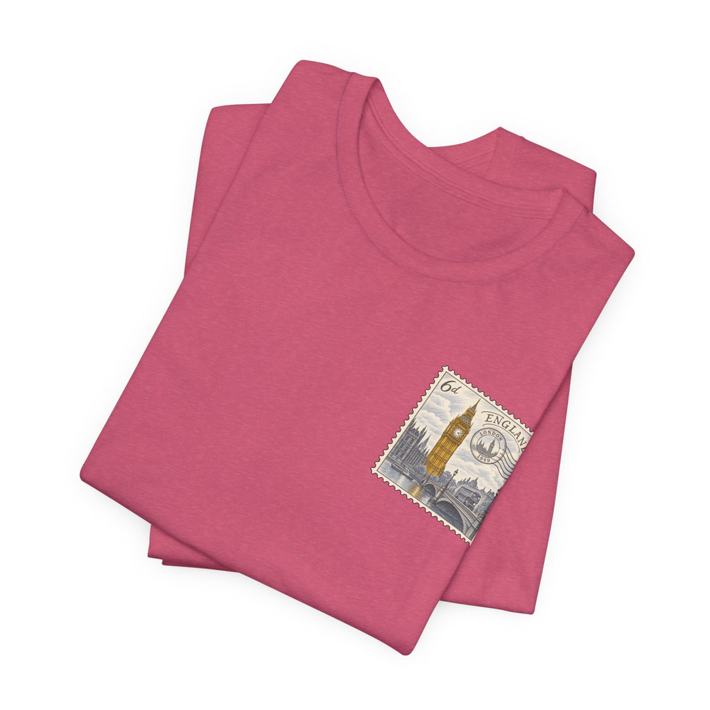 Rose-red T-shirt with short sleeves and a small vintage postage stamp graphic on the chest