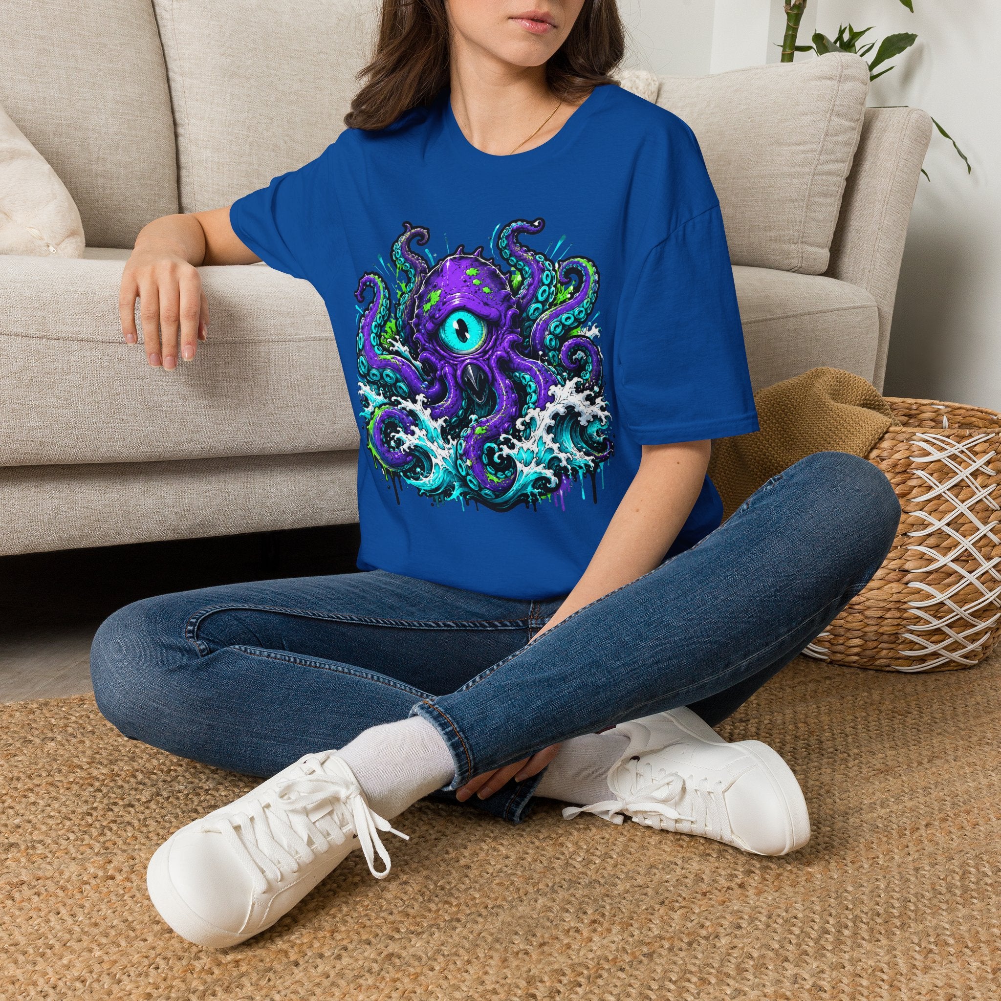 Royal blue graphic octopus monster T-shirt with purple eye and teal tentacles
