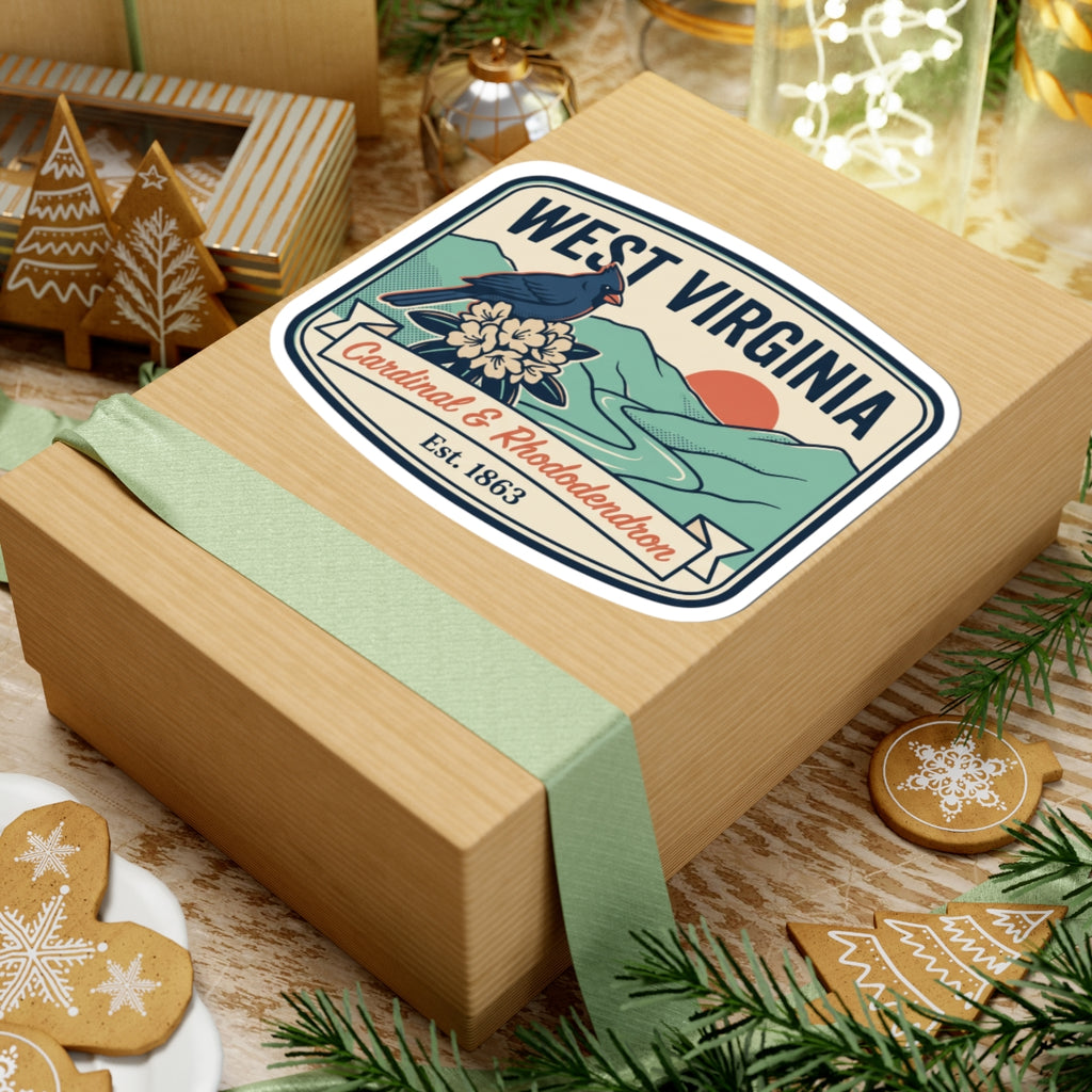 West Virginia sticker on a holiday gift box, cardinal and rhododendron, Est. 1863.