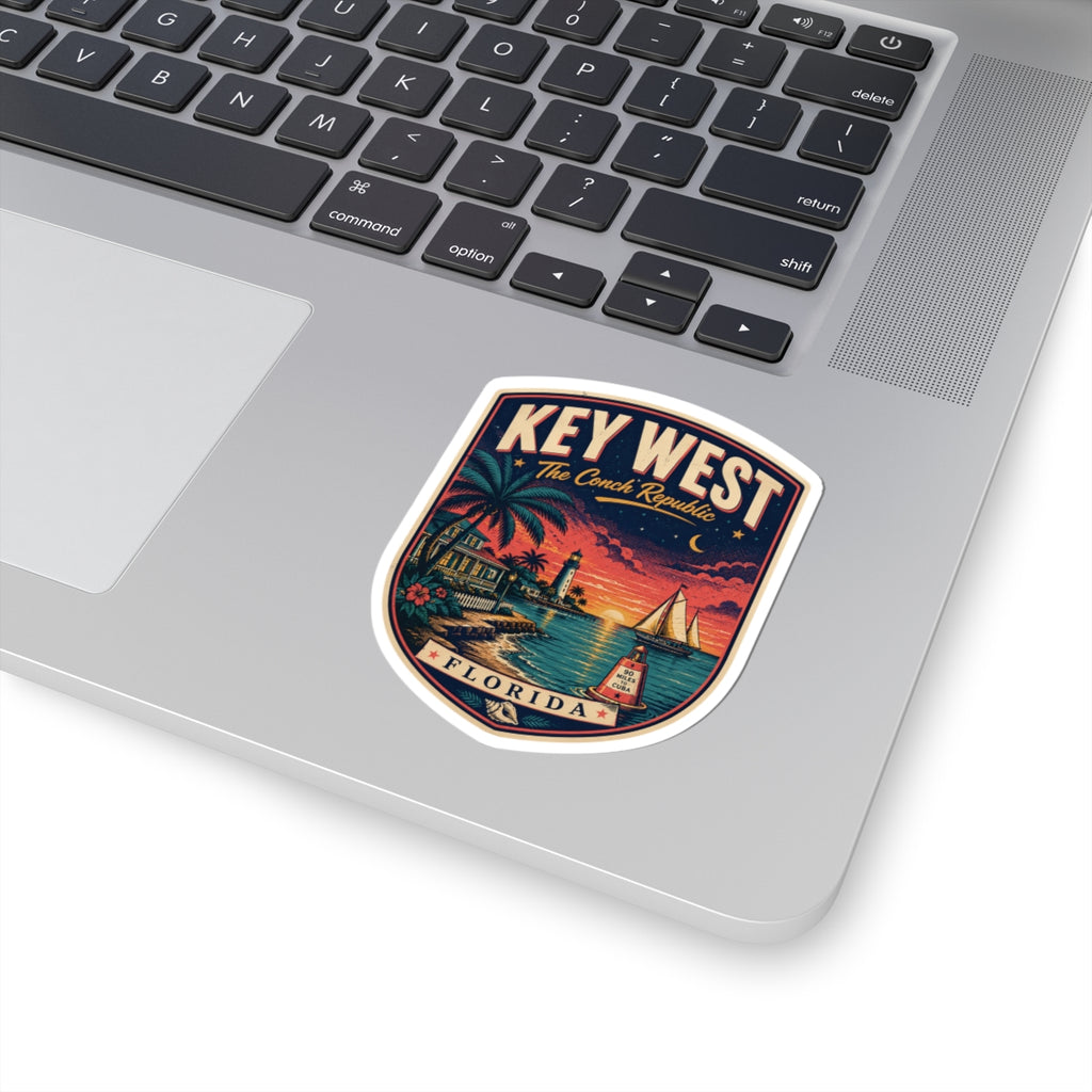 Key West luggage tag sticker on a laptop keyboard, palm harbor scene with 'KEY WEST'/'FLORIDA'