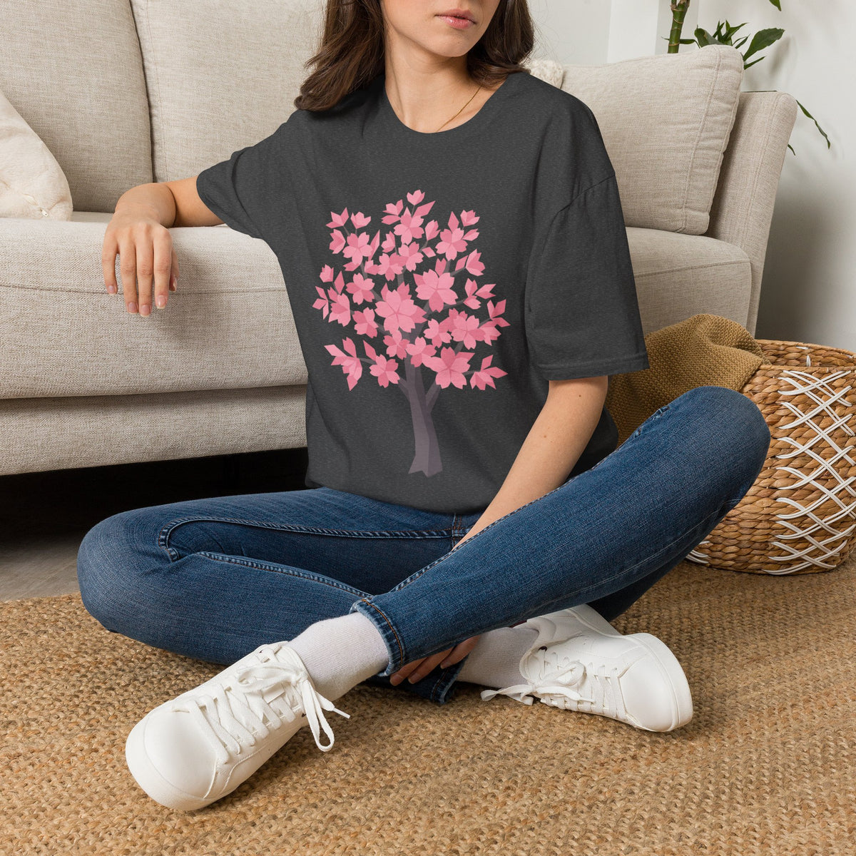 Cherry blossom tree graphic T-shirt on model, charcoal with pink cherry blossom tree print