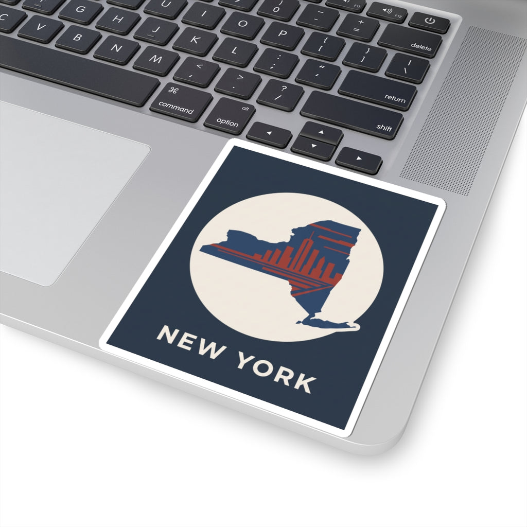 New York skyline sticker on laptop trackpad area: blue border, red skyline silhouette, “NEW YORK”