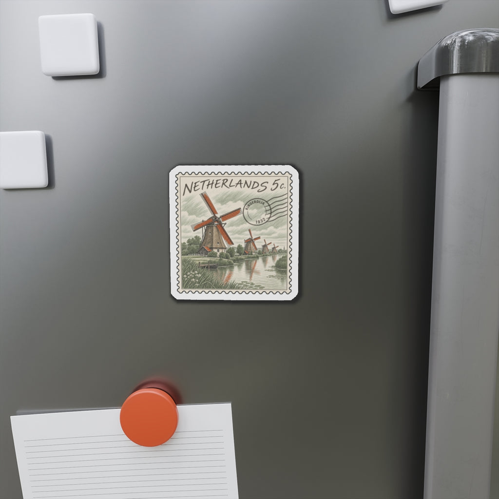 Die-cut magnet on stainless fridge door displaying Netherlands 5c windmill stamp