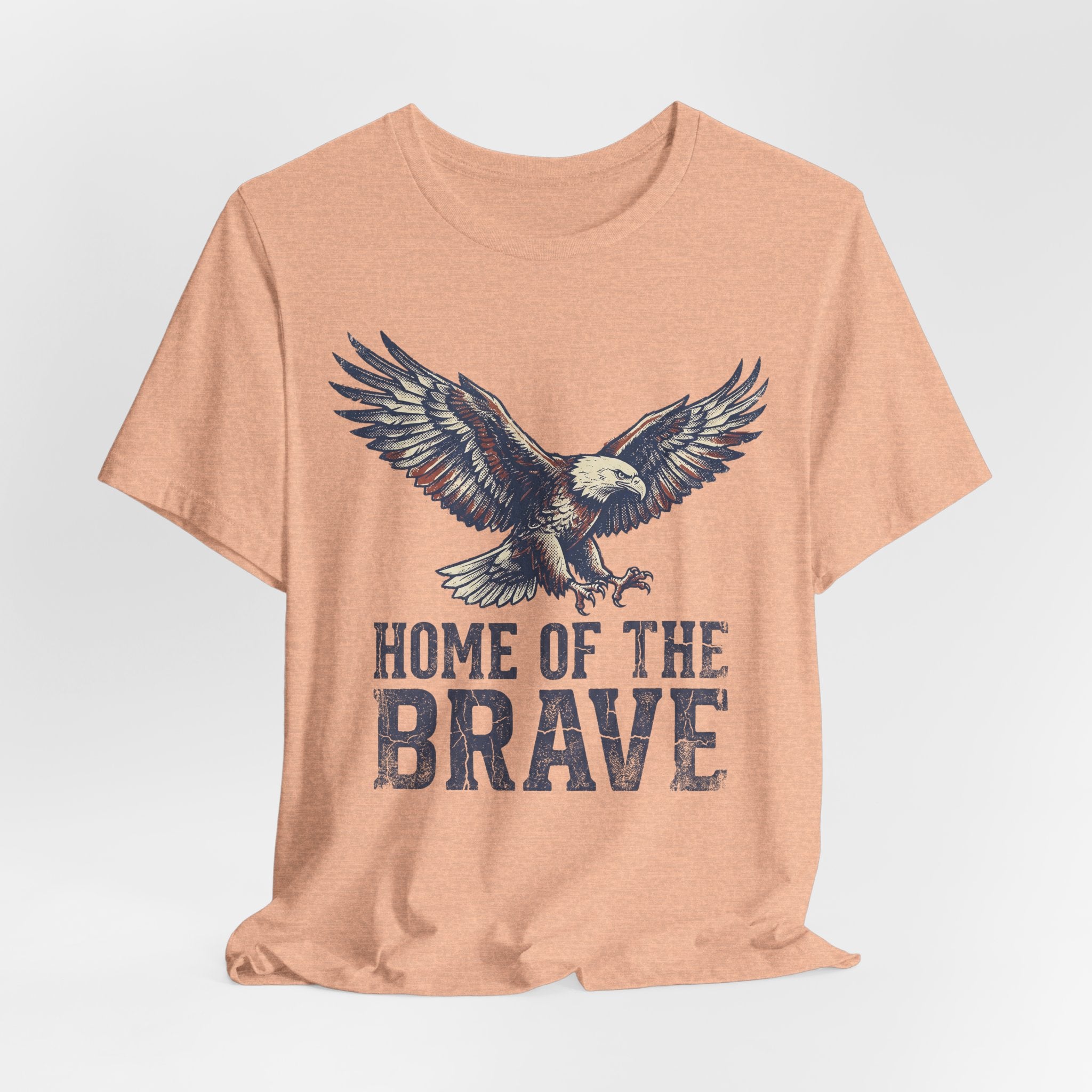 Heather peach crew-neck T-shirt with bald eagle and 'HOME OF THE BRAVE' text