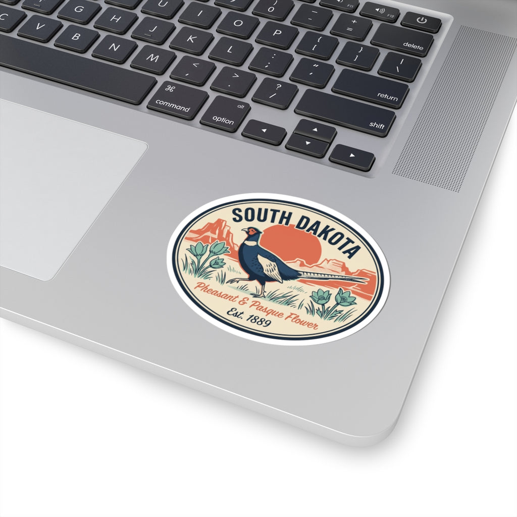 South Dakota pheasant sticker placed on a laptop lid, circular badge with Est. 1889