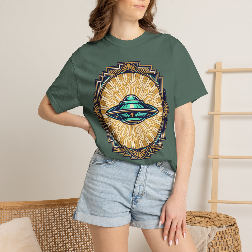 Teal crew-neck T-shirt worn by model; front shows a retro UFO with sunburst emblem.
