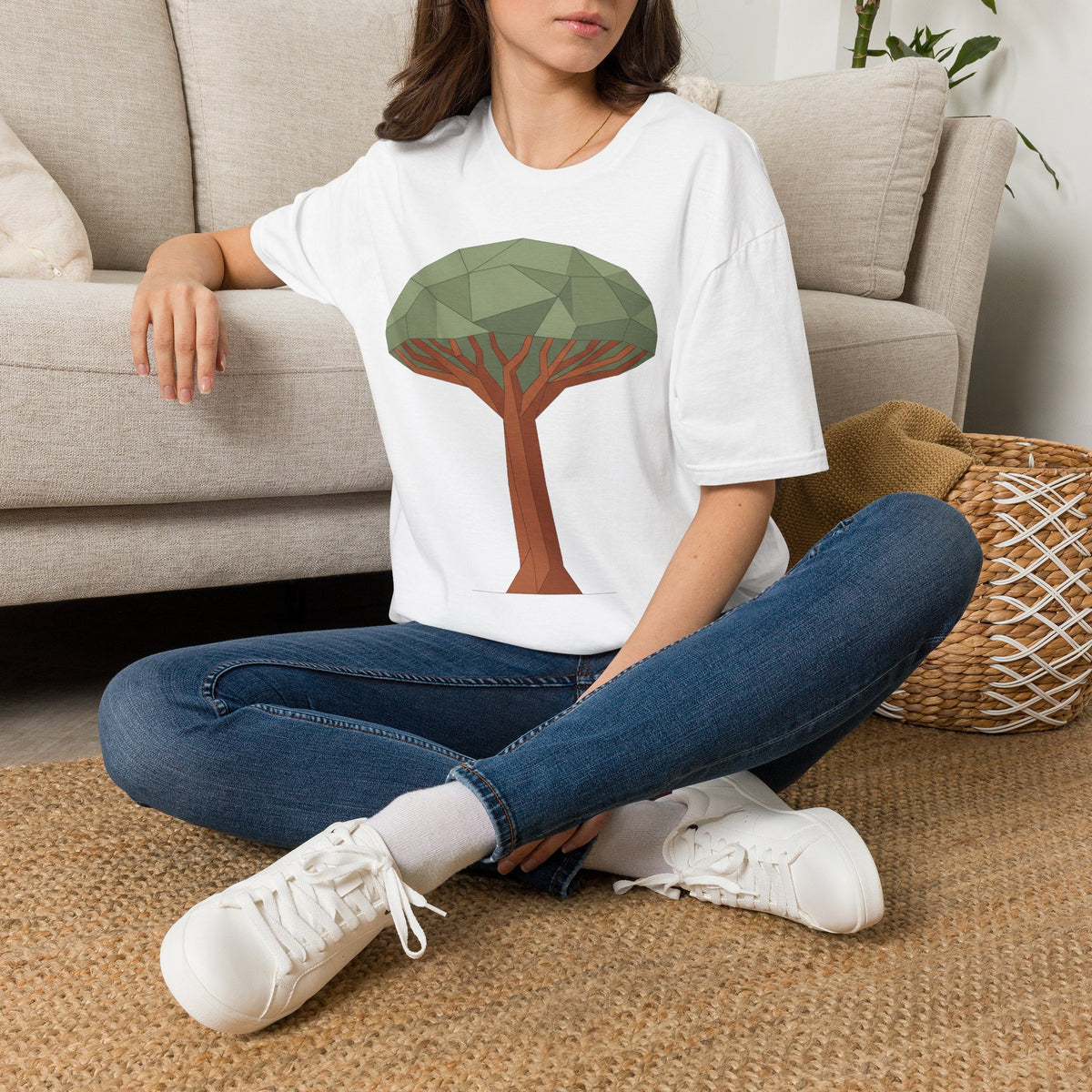 White acacia tree graphic t-shirt worn by a model, featuring a geometric tree on front.
