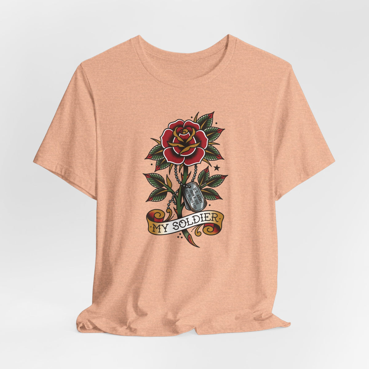 Salmon pink short-sleeve crewneck T-shirt with rose and dog tag tattoo graphic.