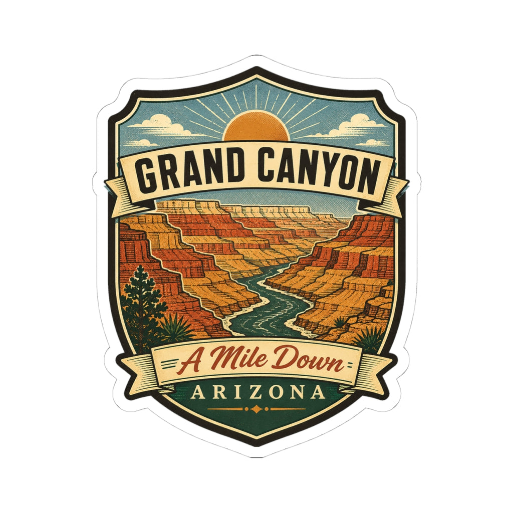 Shield-shaped travel sticker featuring canyon scenery, “GRAND CANYON,” “A Mile Down,” “ARIZONA.”