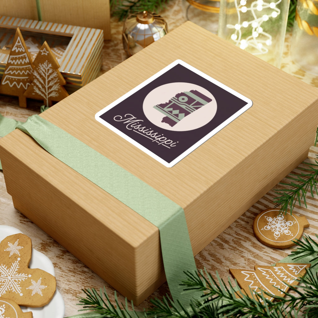 Mississippi sticker decal on holiday gift box, square border with round emblem and cursive text