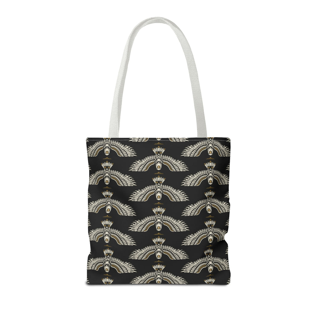 Tote bag front view with black base and repeating winged scarab design, white handles