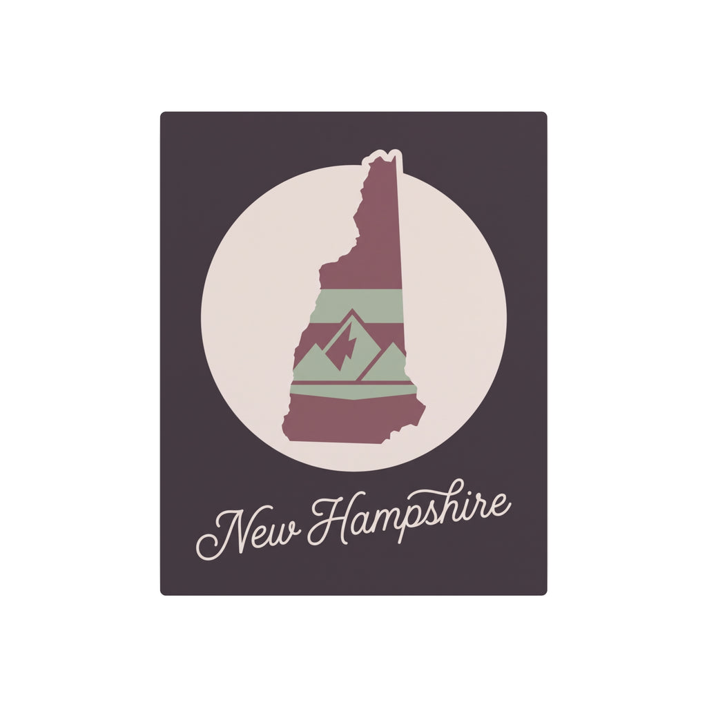 New Hampshire metal wall art with mauve, green, and maroon state design in a circle