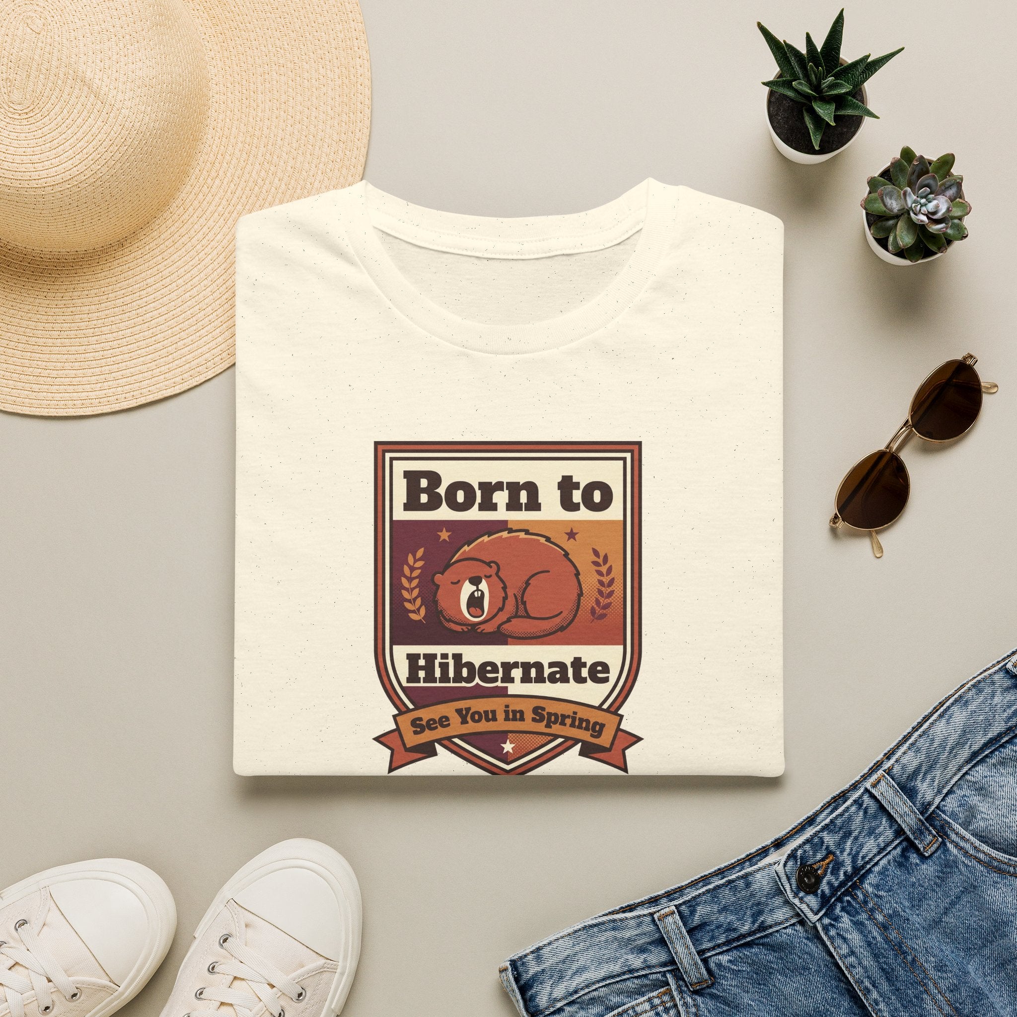 White graphic T-shirt with centered bear "Born to Hibernate" badge print