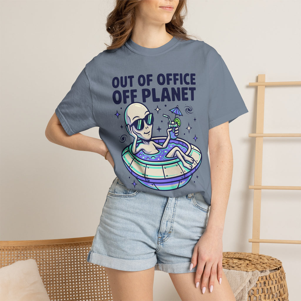 Light blue T-shirt with alien on floatie graphic and 'OUT OF OFFICE OFF PLANET' text