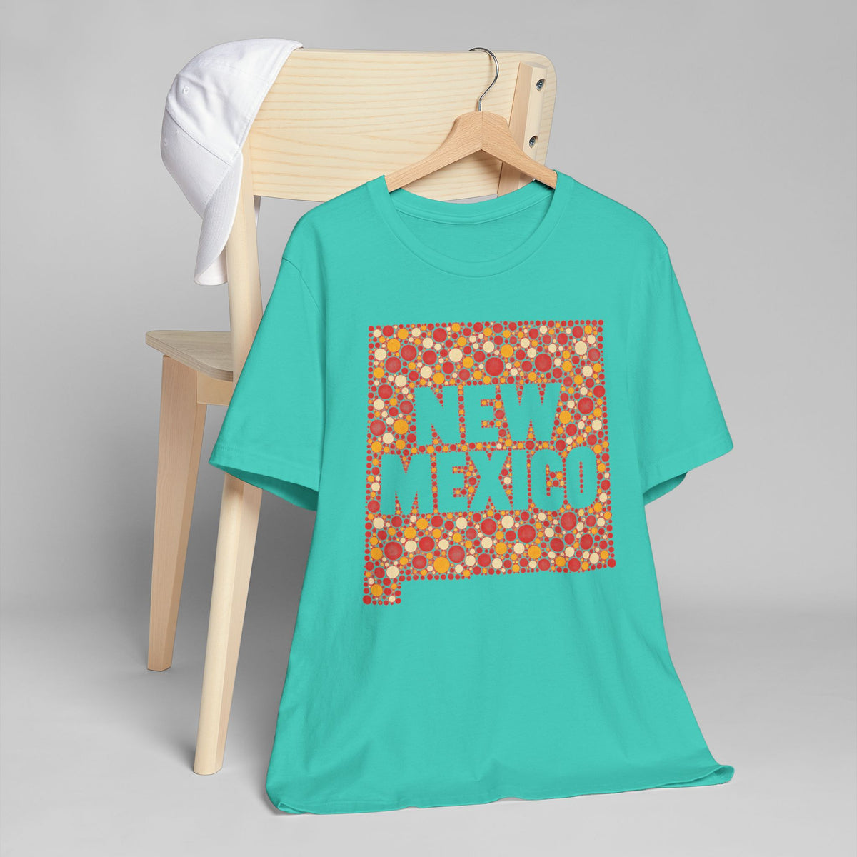 Teal crewneck t-shirt with colorful New Mexico floral map graphic
