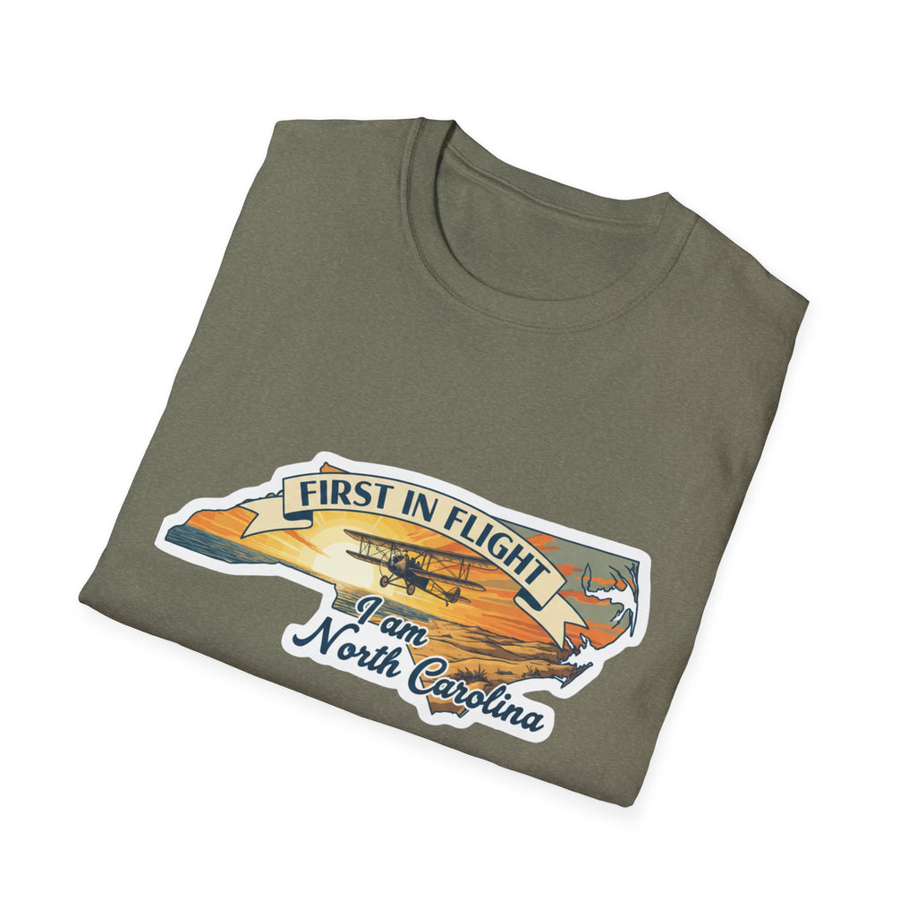Olive green T-shirt with “First in Flight” plane graphic and North Carolina text