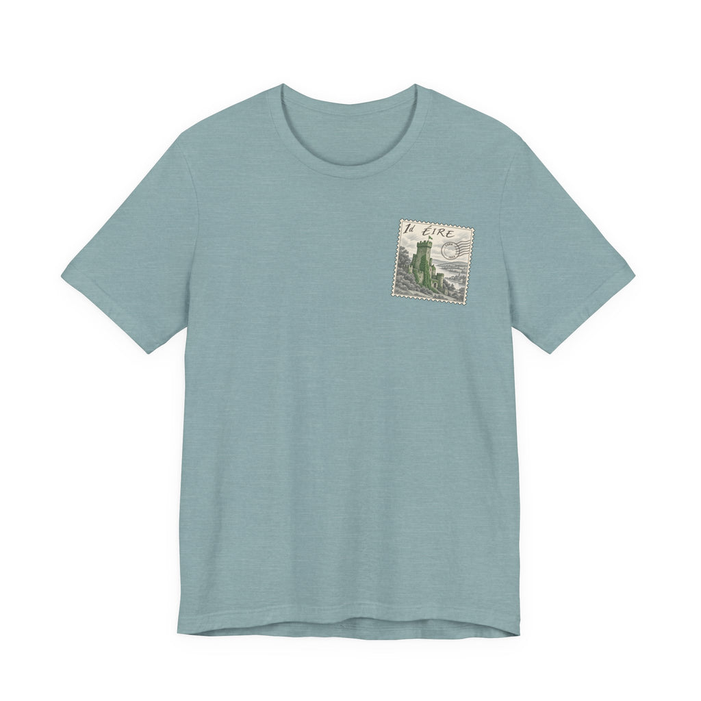 Light teal crewneck t-shirt with small vintage postage stamp graphic on chest