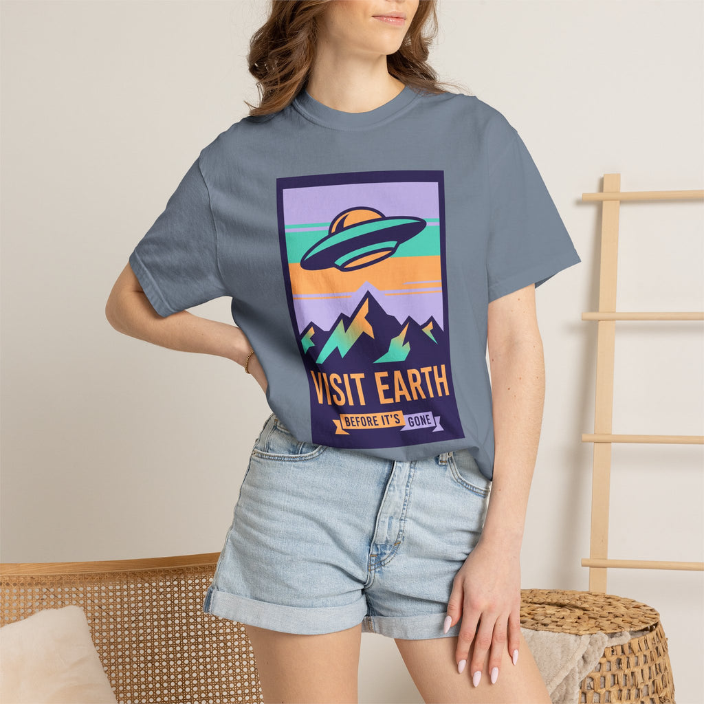 Blue-gray crewneck T-shirt with retro UFO and “VISIT EARTH” graphic on chest