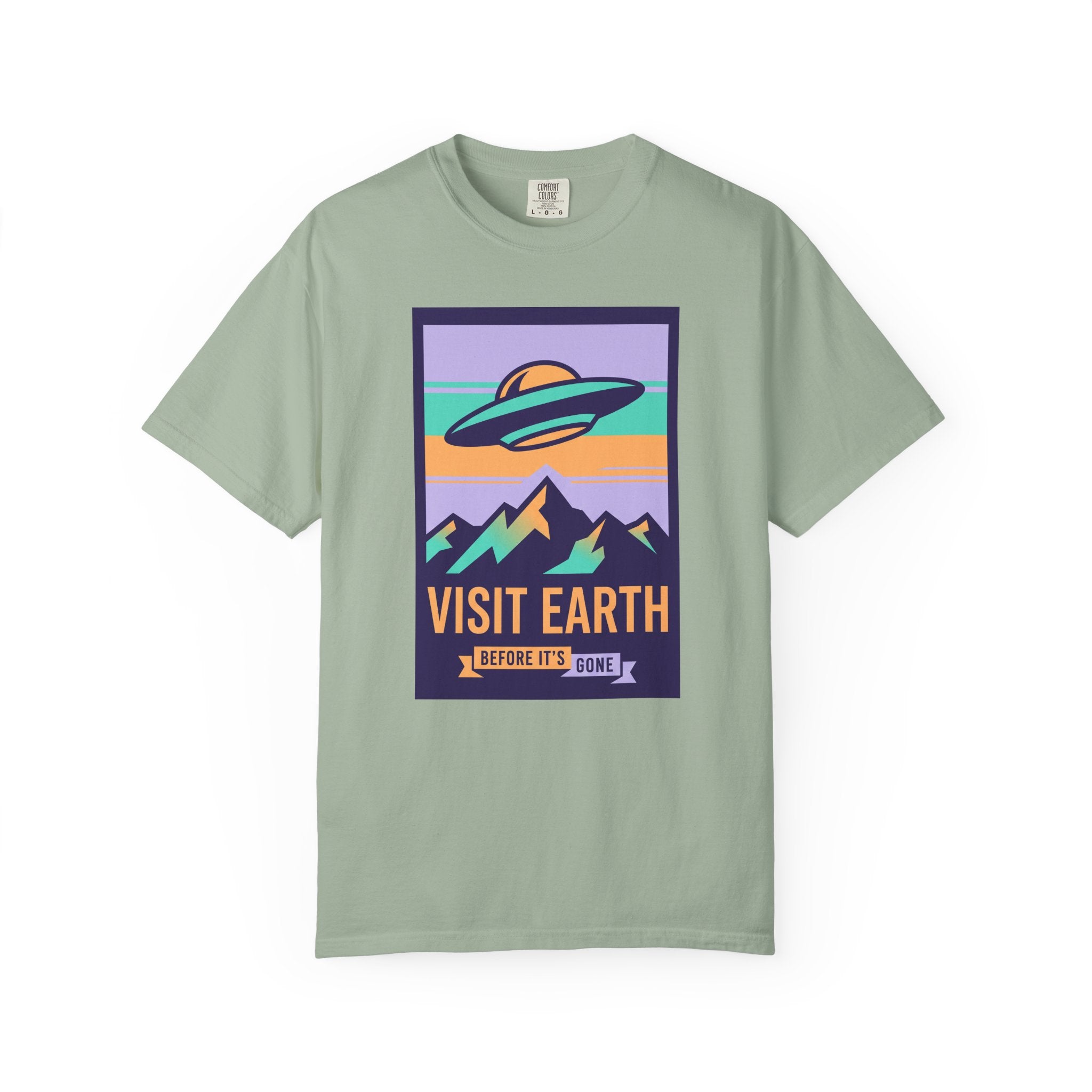 T-shirt with 'Visit Earth' UFO over mountains graphic, sage green