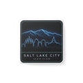 Square porcelain magnet with neon blue Salt Lake City skyline and mountain outline