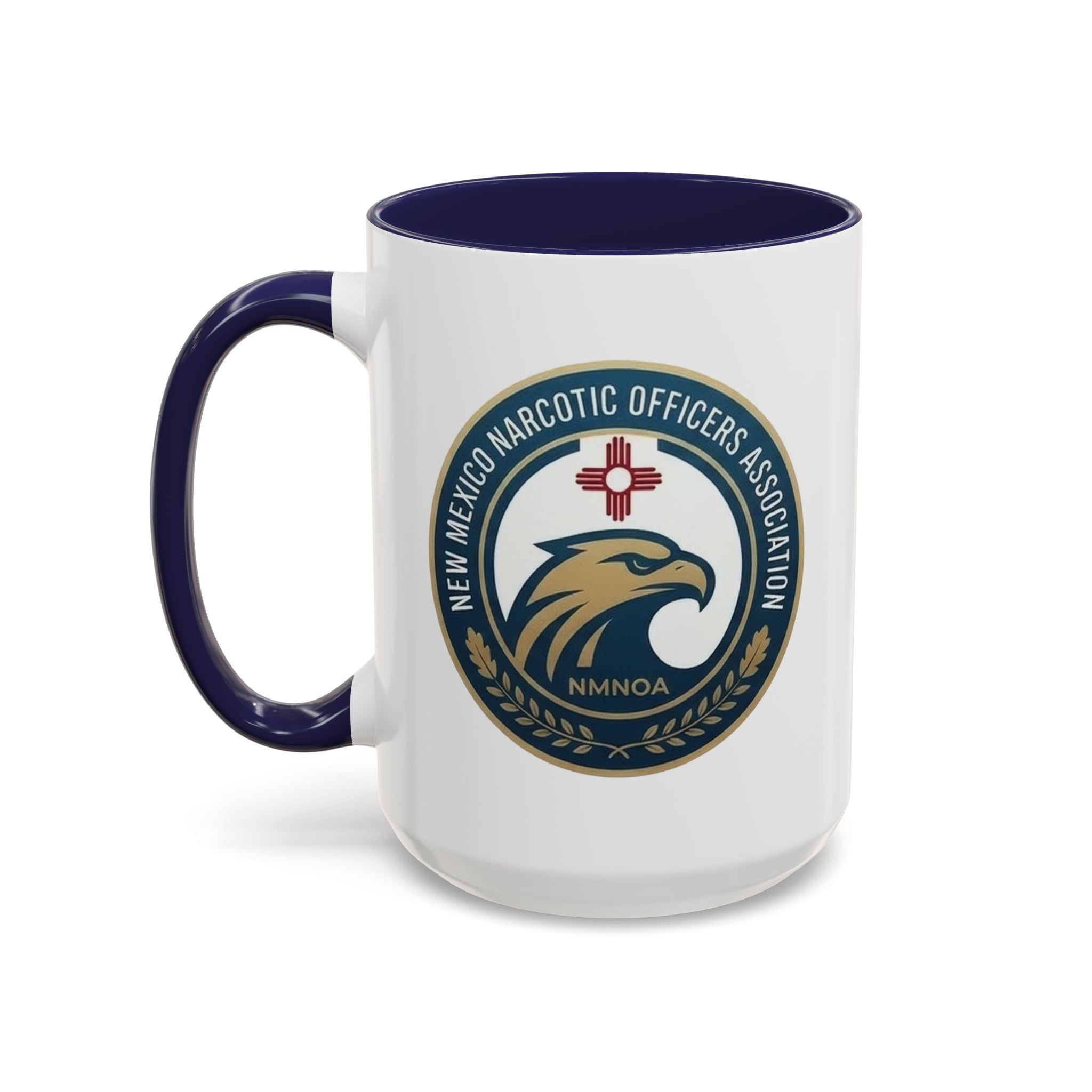 White coffee mug with navy handle and interior, featuring NMNOA circular logo on front.