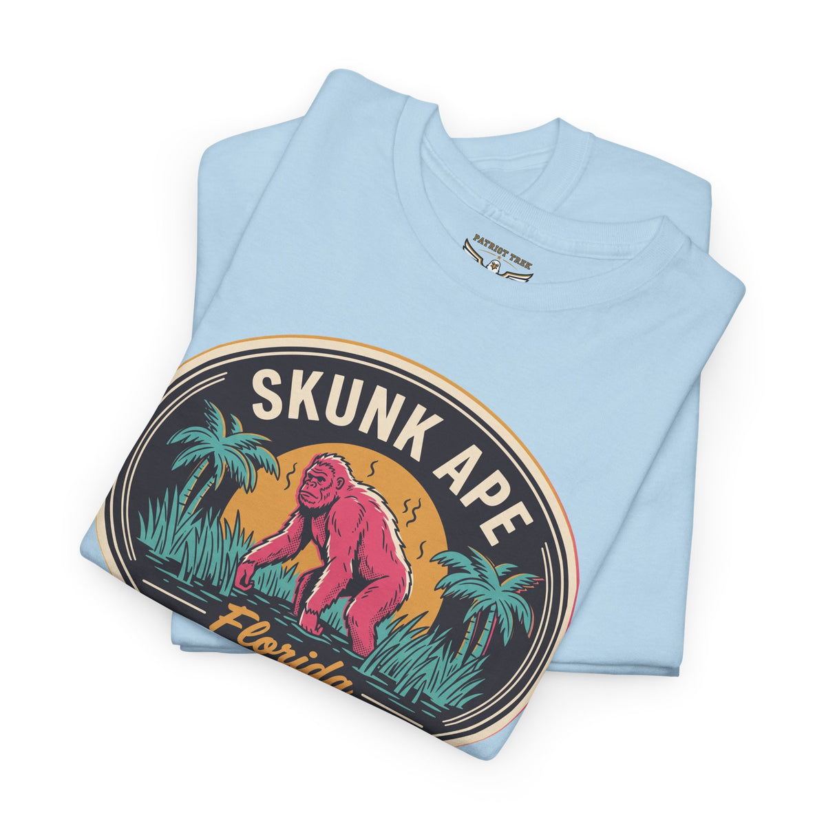 Light blue crewneck T-shirt with circular "SKUNK APE" graphic and palm trees
