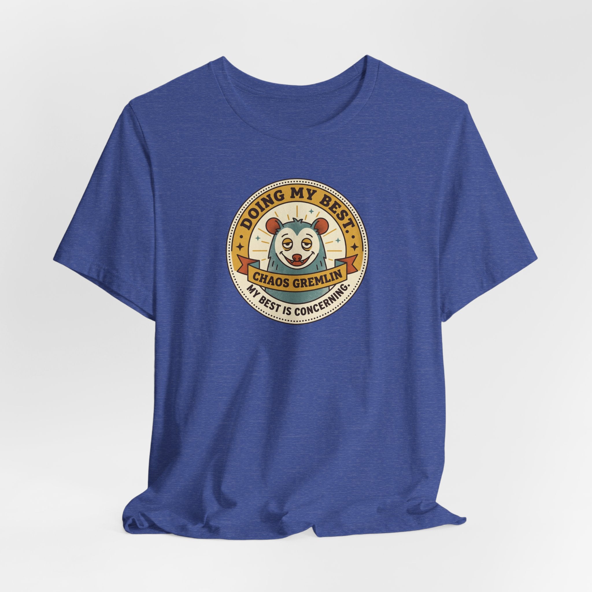Blue crew-neck T-shirt with round gremlin badge design on the chest