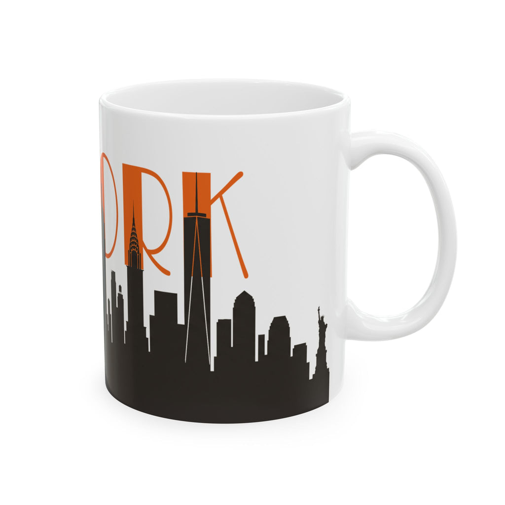 White ceramic coffee mug with orange “ORK” text and black city skyline