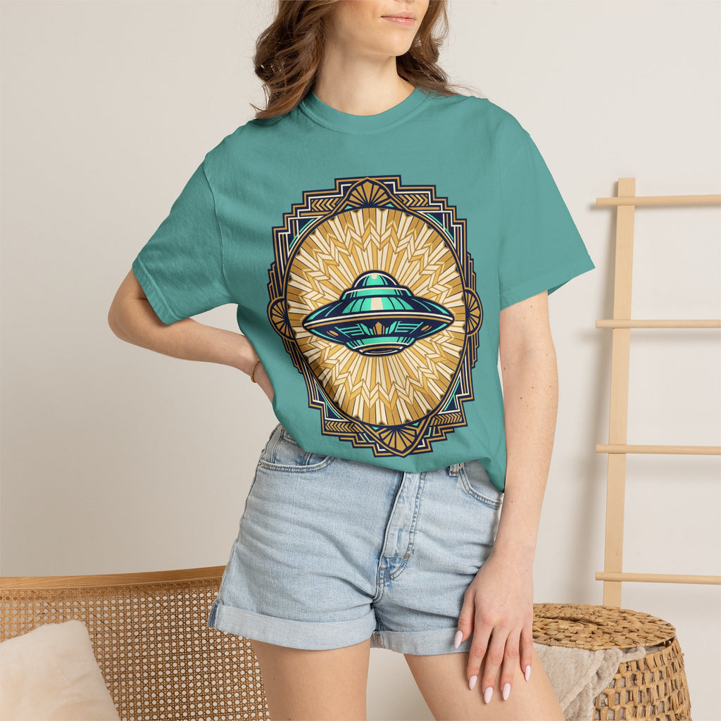 Teal crew-neck T-shirt worn by model; front features a retro UFO sunburst graphic.