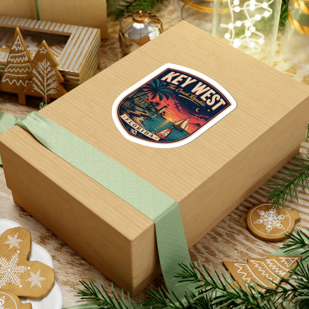 Key West luggage tag sticker on a wooden gift box, Conch Republic shield with palm harbor